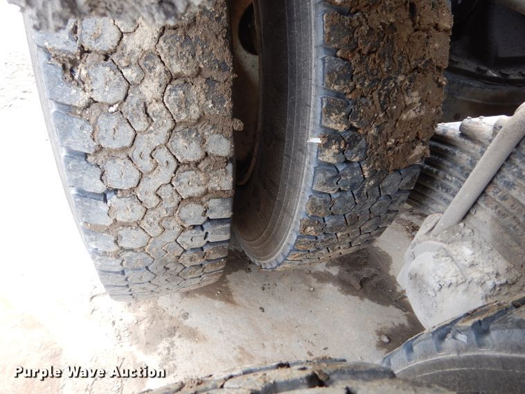 image for item IY9722 2004 Mack DM690S  roll-off container truck