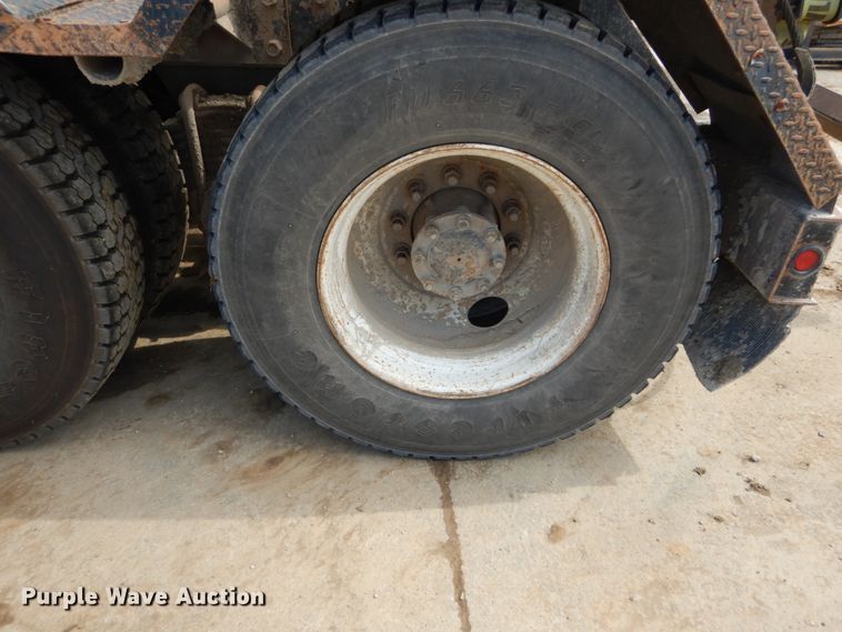 image for item IY9722 2004 Mack DM690S  roll-off container truck