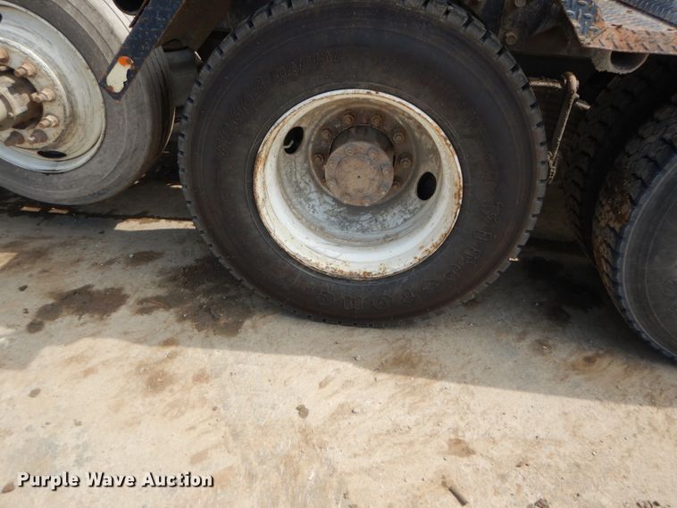 image for item IY9722 2004 Mack DM690S  roll-off container truck