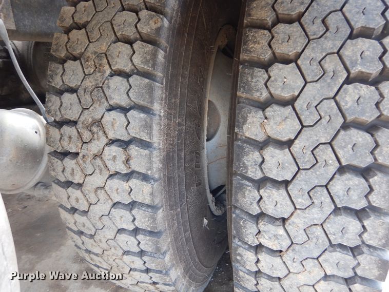 image for item IY9722 2004 Mack DM690S  roll-off container truck