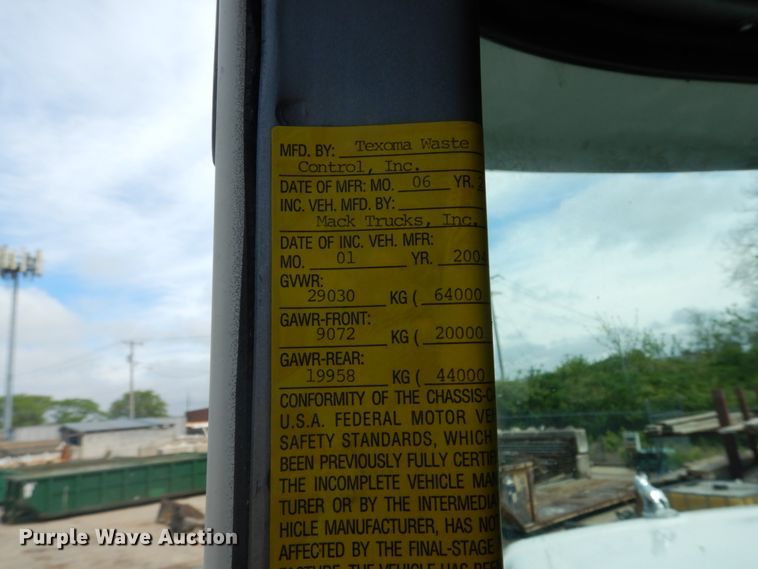 image for item IY9722 2004 Mack DM690S  roll-off container truck