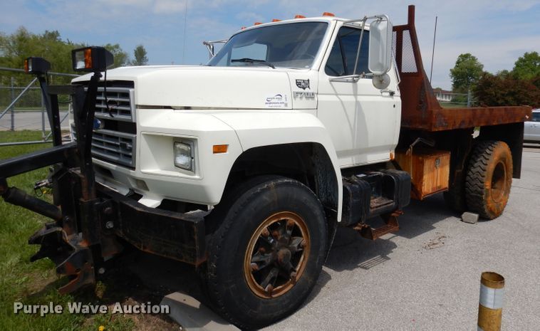 image for item DI6619 1992 Ford F700  dump flatbed truck