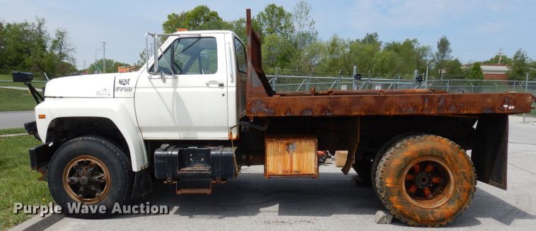 image for item DI6619 1992 Ford F700  dump flatbed truck