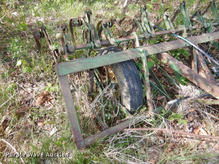 image for item DL8032 John Deere CCA  chisel and International hay rake