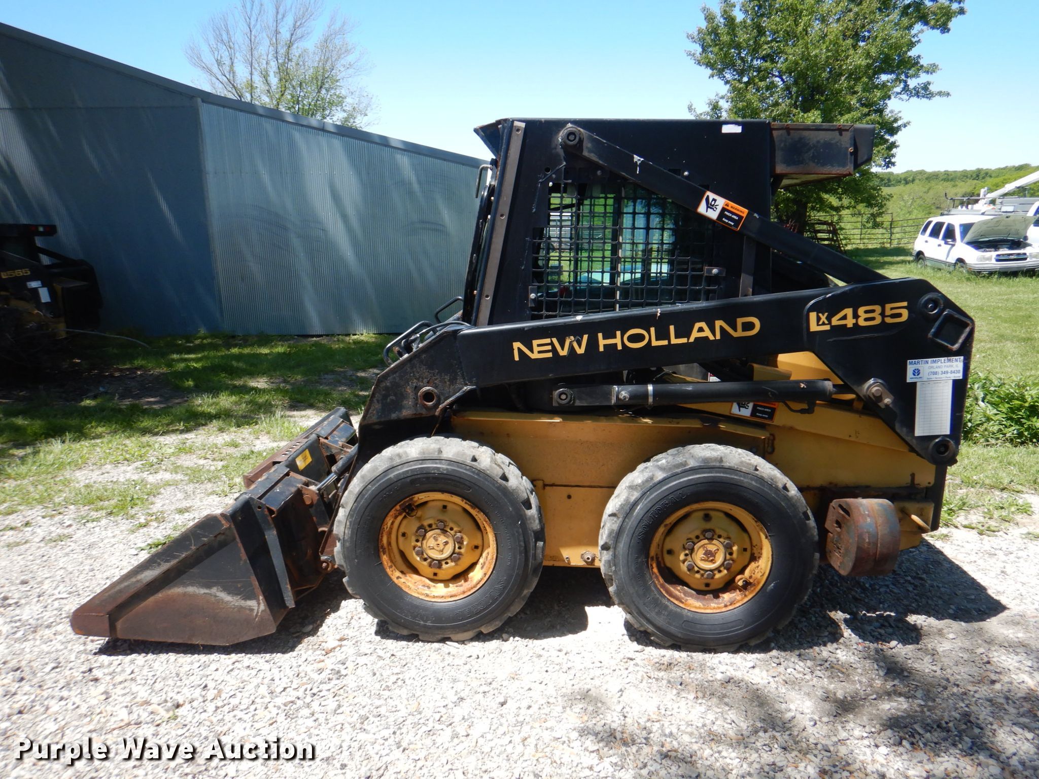 1999 New Holland LX485 skid steer loader in Leeton, MO Item IQ9480