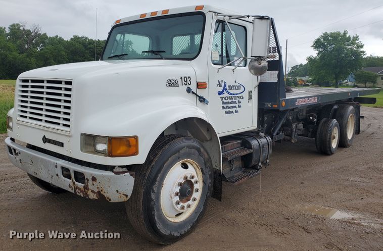 image for item DI5163 1999 International 4700  rollback truck