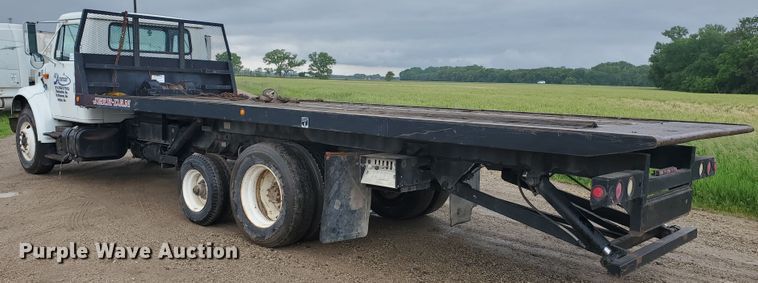 image for item DI5163 1999 International 4700  rollback truck