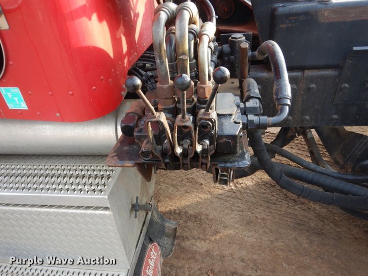 image for item HE9570 2000 Peterbilt 330  roll-off container truck