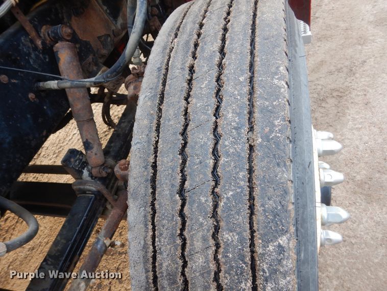 image for item HE9570 2000 Peterbilt 330  roll-off container truck