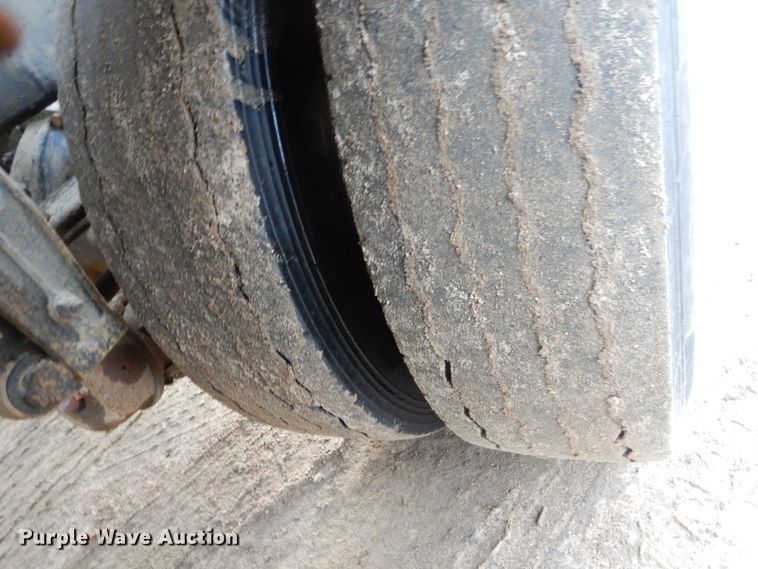 image for item HE9570 2000 Peterbilt 330  roll-off container truck