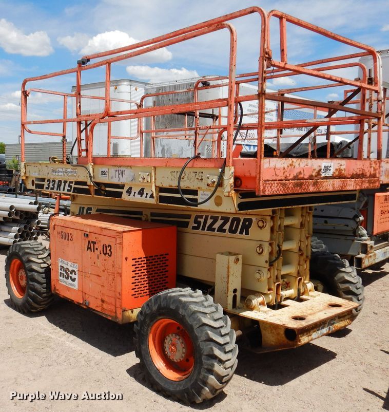 image for item IQ9547 1997 JLG 33RTS  scissor lift