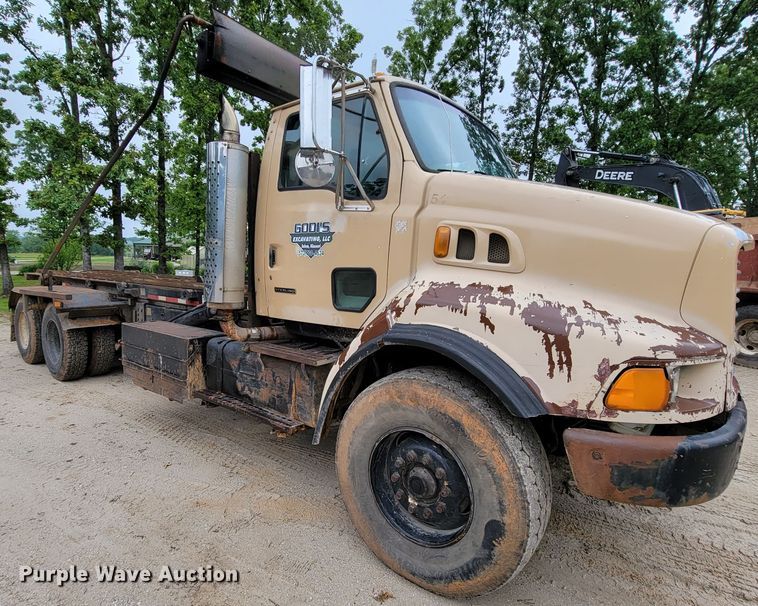 image for item IF9843 1999 Sterling A9500  roll-off container truck