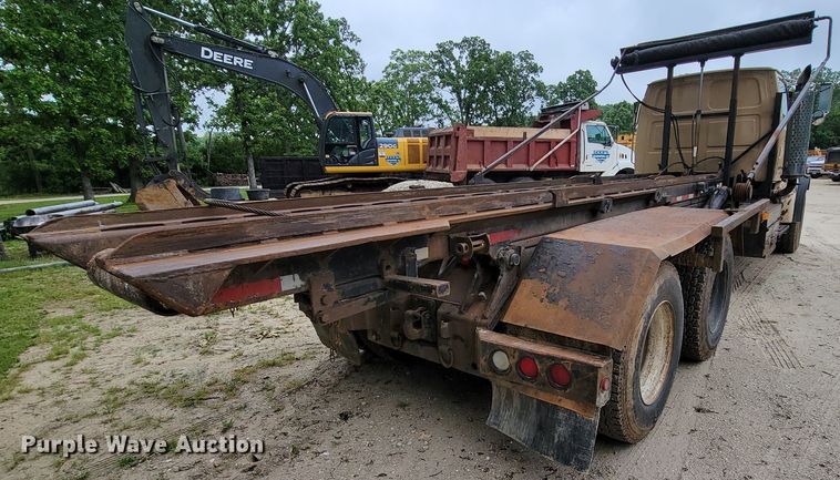 image for item IF9843 1999 Sterling A9500  roll-off container truck