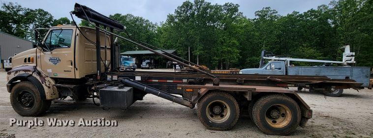 image for item IF9843 1999 Sterling A9500  roll-off container truck