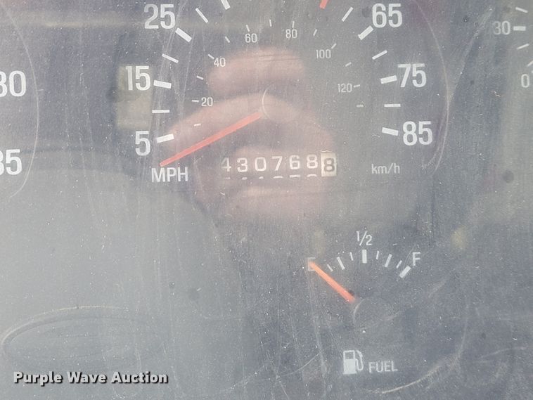 image for item IF9843 1999 Sterling A9500  roll-off container truck