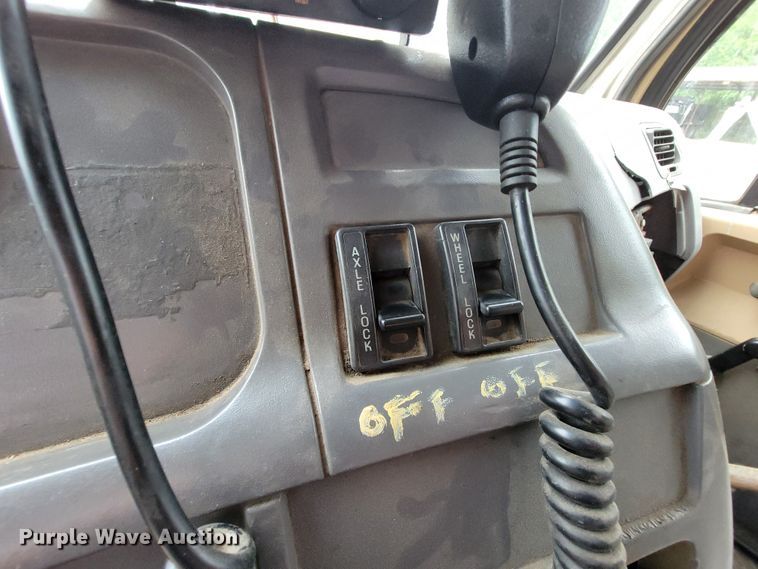 image for item IF9843 1999 Sterling A9500  roll-off container truck