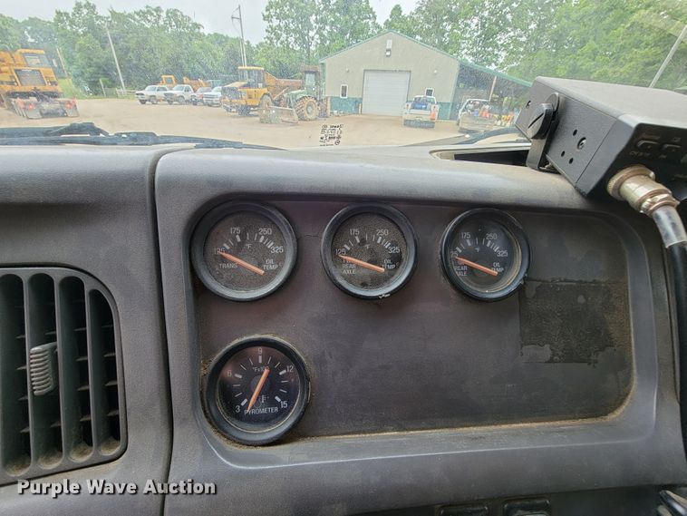 image for item IF9843 1999 Sterling A9500  roll-off container truck