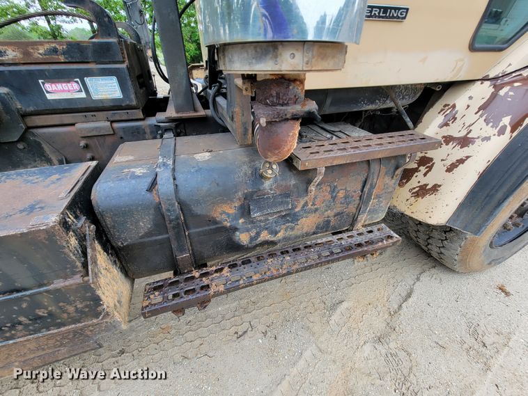 image for item IF9843 1999 Sterling A9500  roll-off container truck