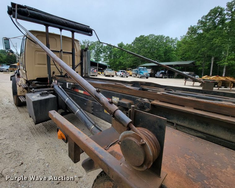 image for item IF9843 1999 Sterling A9500  roll-off container truck