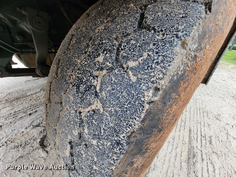 image for item IF9843 1999 Sterling A9500  roll-off container truck