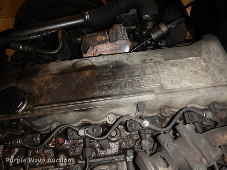 image for item DI6721 1999 Isuzu NPR  flatbed truck