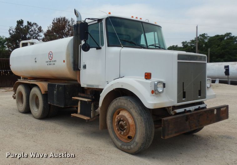 image for item DC2052 1990 White GMC WCS  water truck