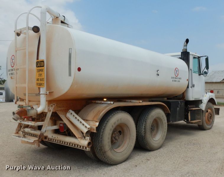 image for item DC2052 1990 White GMC WCS  water truck