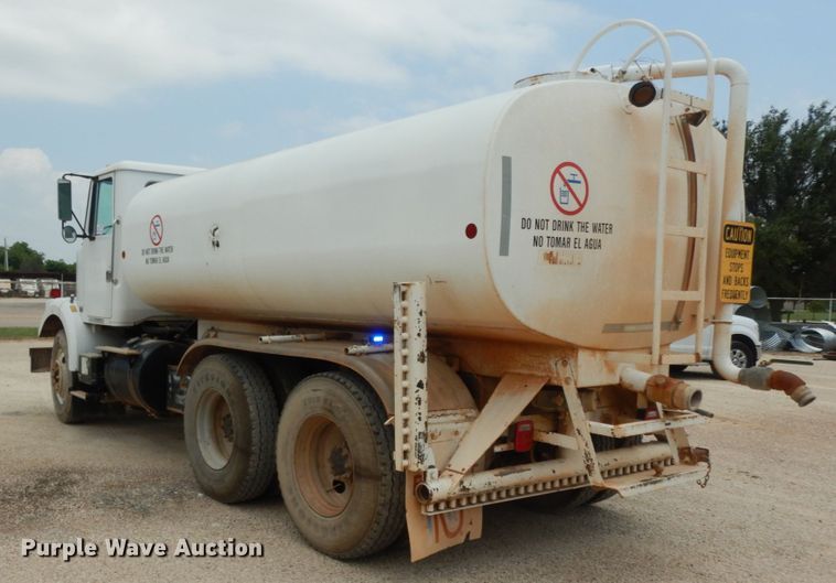 image for item DC2052 1990 White GMC WCS  water truck