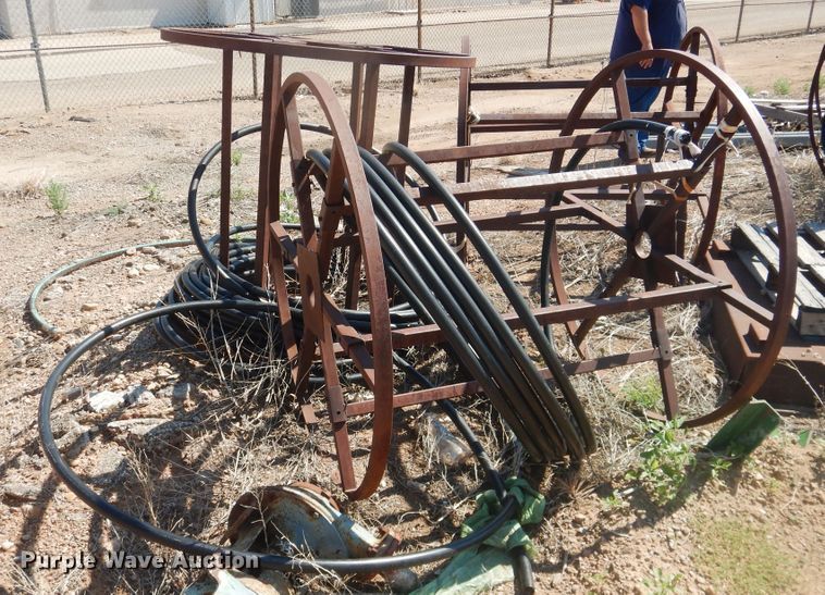 (7) reels with poly pipe in TX Item IJ9445 sold Purple Wave