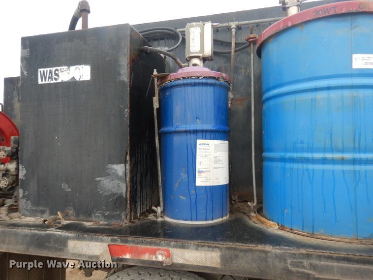 image for item DC2021 2000 Ford F650  flatbed truck with fuel / lube system