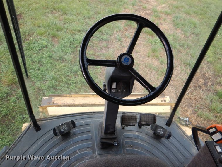 image for item DL3323 1999 New Holland TR99  combine