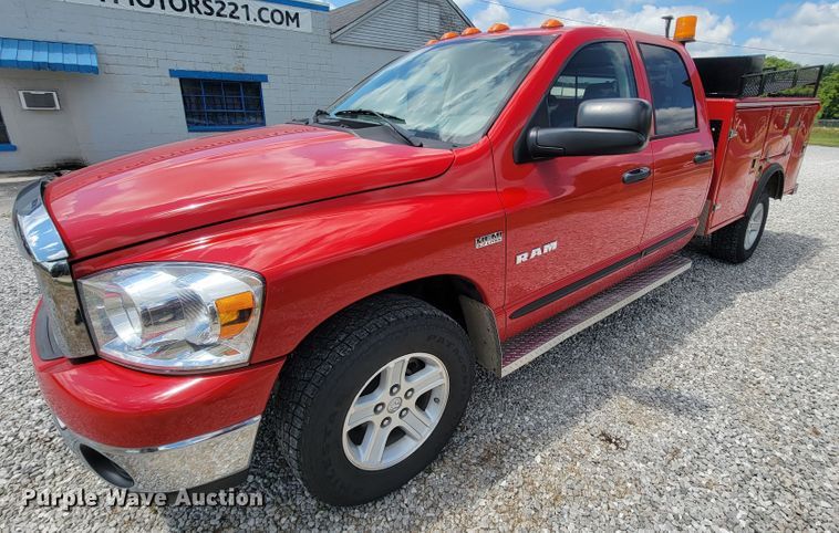 image for item IF9971 2008 Dodge Ram 1500  Quad Cab utility bed pickup truck