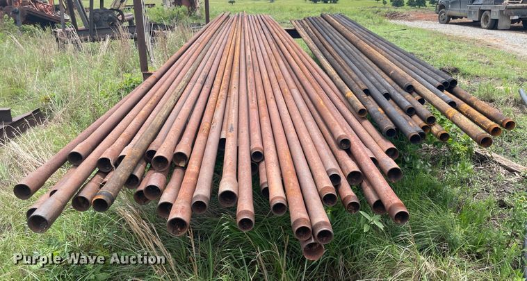 image for item IR9513 Approximately 77 2 3/8" diameter oilfield pipes