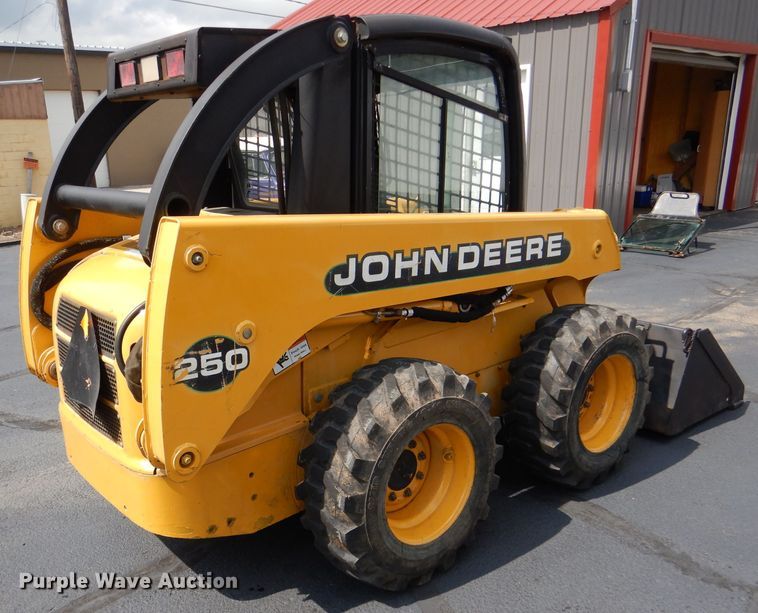 image for item DL3325 1999 John Deere 250  skid steer loader