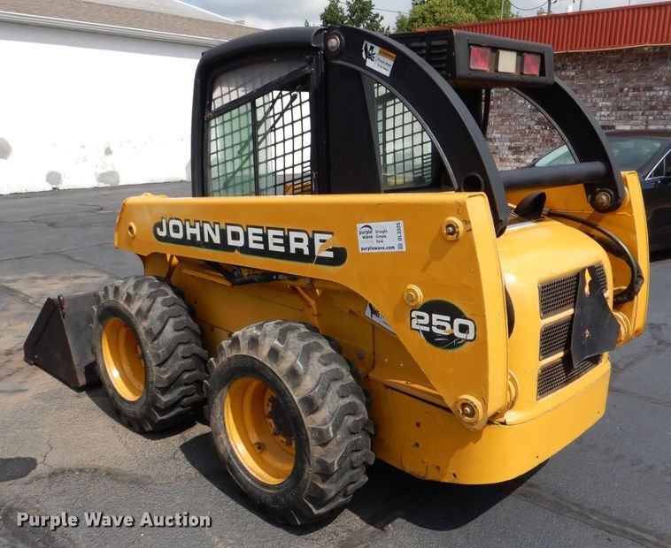 image for item DL3325 1999 John Deere 250  skid steer loader