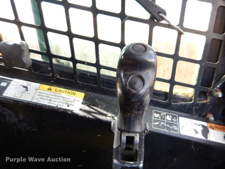 image for item DL3325 1999 John Deere 250  skid steer loader