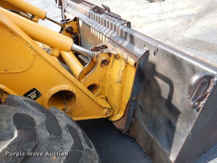 image for item DL3325 1999 John Deere 250  skid steer loader