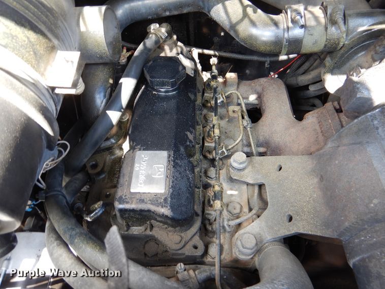 image for item DL3325 1999 John Deere 250  skid steer loader