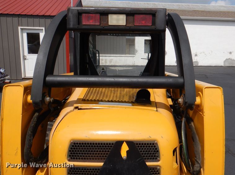 image for item DL3325 1999 John Deere 250  skid steer loader