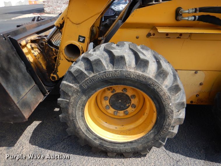 image for item DL3325 1999 John Deere 250  skid steer loader