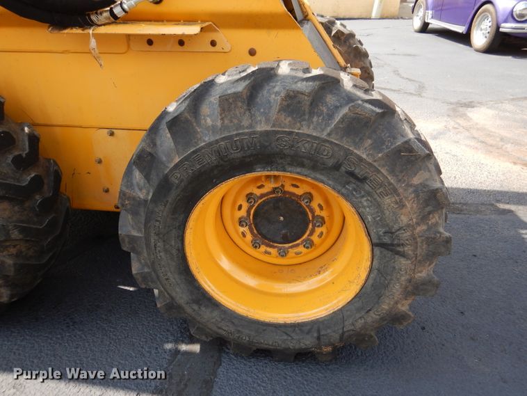 image for item DL3325 1999 John Deere 250  skid steer loader