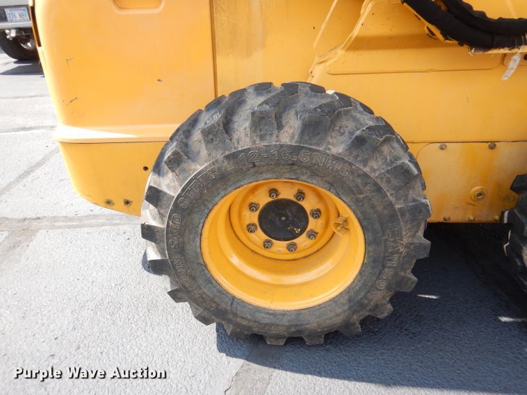 image for item DL3325 1999 John Deere 250  skid steer loader