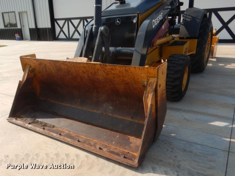 image for item IN9497 2014 John Deere 210K  landscape tractor