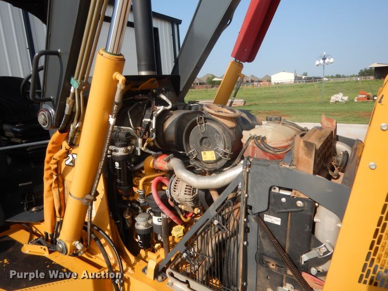 image for item IN9497 2014 John Deere 210K  landscape tractor