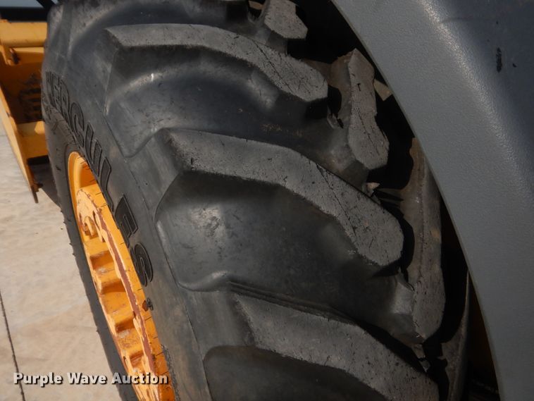 image for item IN9497 2014 John Deere 210K  landscape tractor