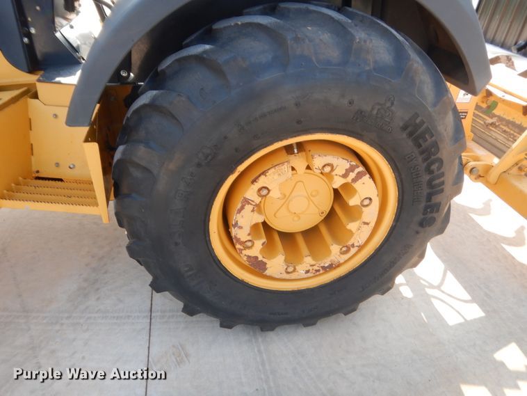 image for item IN9497 2014 John Deere 210K  landscape tractor