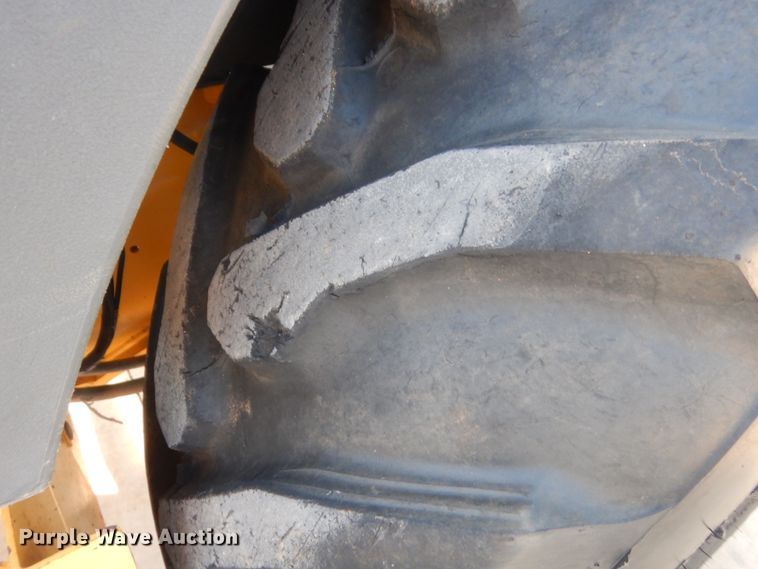 image for item IN9497 2014 John Deere 210K  landscape tractor