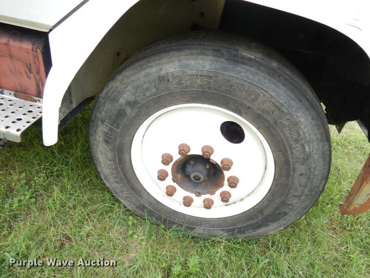 image for item DG0841 2002 Freightliner FL60  flatbed truck