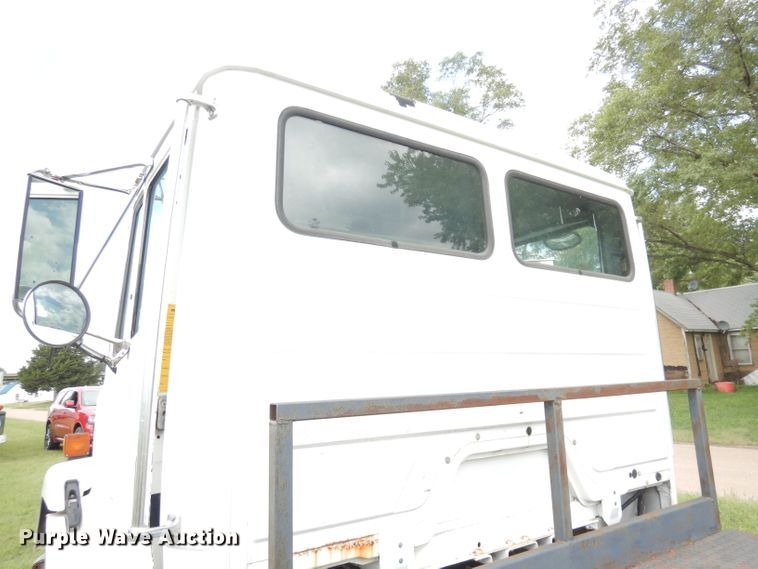 image for item DG0841 2002 Freightliner FL60  flatbed truck