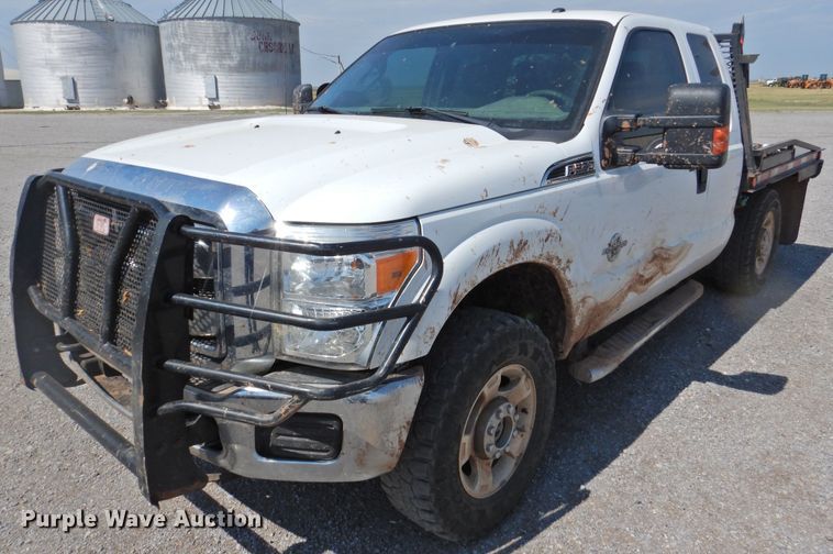 image for item DK2429 2015 Ford F250 Super Duty  SuperCab bale bed pickup truck